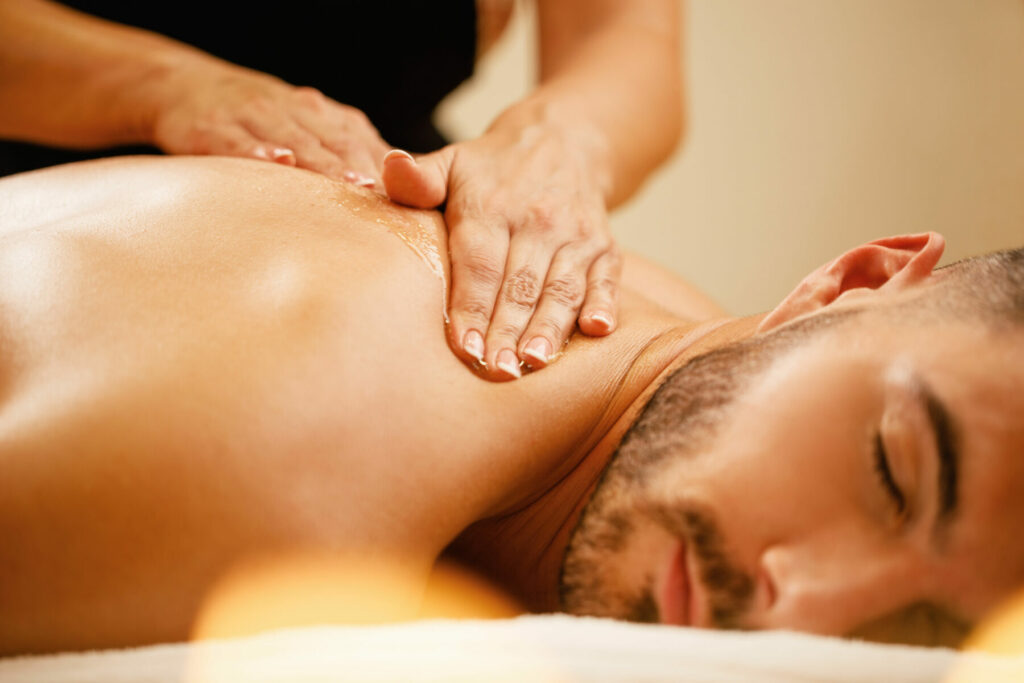 man having back massage